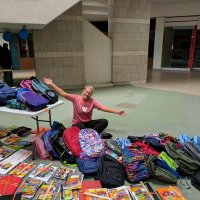 Donating school supplies to Knowledge Academy