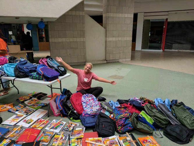Donating school supplies to Knowledge Academy