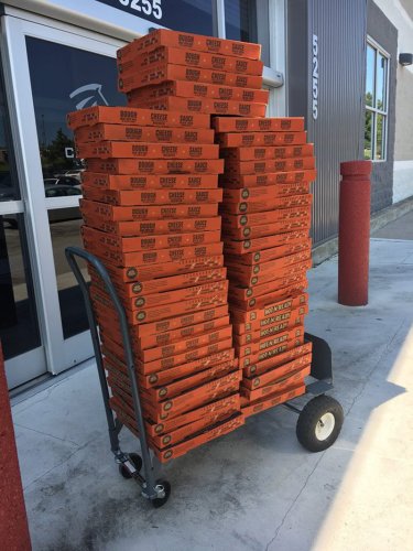 Boxes and boxes of pizza for the Cavalry office
